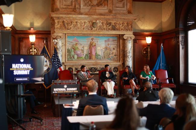 NLIHC Senior Director of Policy Kim Johnson, Cynthia Cuestas from the Council of Large Public Housing Agencies, and Nikitra Bailey from the National Fair Housing Alliance with Rep. Richie Torres (D-NY) at the National Summit on Housing Affordability Crisis on September 3, 2025. 