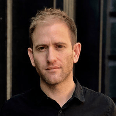 A headshot of Brian Goldstone